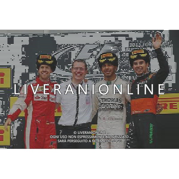 The podium (L to R): Sebastian Vettel (GER) Ferrari, second; Lewis Hamilton (GBR) Mercedes AMG F1, race winner; Sergio Perez (MEX) Sahara Force India F1, third. 11.10.2015. Formula 1 World Championship, Rd 15, Russian Grand Prix, Sochi Autodrom, Sochi, Russia, Race Day. - www.xpbimages.com, EMail: requests@xpbimages.com - copy of publication required for printed pictures. Every used picture is fee-liable. © Copyright: Batchelor / XPB Images /Agenzia Aldo Liverani s.a.s.
