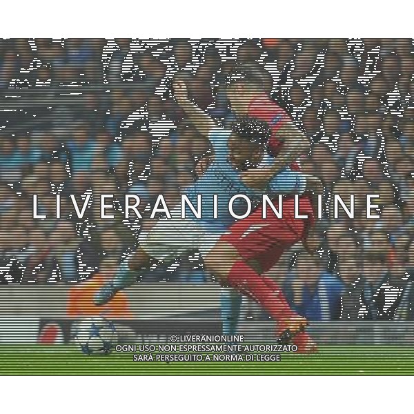 Manchester City\'s Raheem Sterling is held back by Sevilla\'s Vitolo Photographer Dave Howarth/CameraSport Football - UEFA Champions League Group D - Manchester City v Sevilla - Wednesday 21st October 2015 - Etihad Stadium - Manchester - © CameraSport - 43 Linden Ave. Countesthorpe. Leicester. England. LE8 5PG - Tel: +44 (0) 116 277 4147 - admin@camerasport.com - www.camerasport.com/AGENZIA ALDO LIVERANI SAS - ITALY ONLY EDITORIAL USE ONLY