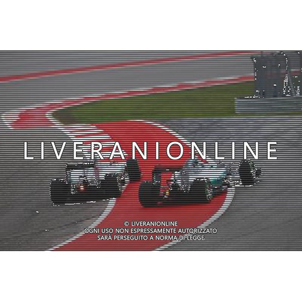(L to R): Lewis Hamilton (GBR) Mercedes AMG F1 W06 and team mate Nico Rosberg (GER) Mercedes AMG F1 W06 battle for position at the start of the race. 25.10.2015. Formula 1 World Championship, Rd 16, United States Grand Prix, Austin, Texas, USA, Race Day. /AGENZIA ALDO LIVERANI SAS - Italy Only editorial use only