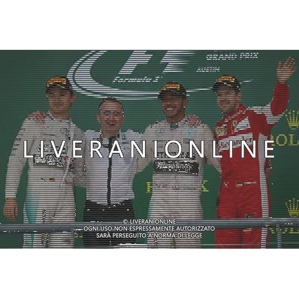 1st place and world champion Lewis Hamilton (GBR) Mercedes AMG F1, with 2nd place Nico Rosberg (GER) Mercedes AMG F1 W06 and 3rd place Sebastian Vettel (GER) Ferrari. 25.10.2015. Formula 1 World Championship, Rd 16, United States Grand Prix, Austin, Texas, USA, Race Day. AG ALDO LIVERANI SAS ONLY ITALY