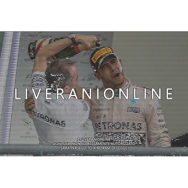 Race winner and World Champion Lewis Hamilton (GBR) Mercedes AMG F1 celebrates on the podium with Paddy Lowe (GBR) Mercedes AMG F1 Executive Director (Technical). 25.10.2015. Formula 1 World Championship, Rd 16, United States Grand Prix, Austin, Texas, USA, Race Day. AG ALDO LIVERANI SAS ONLY ITALY