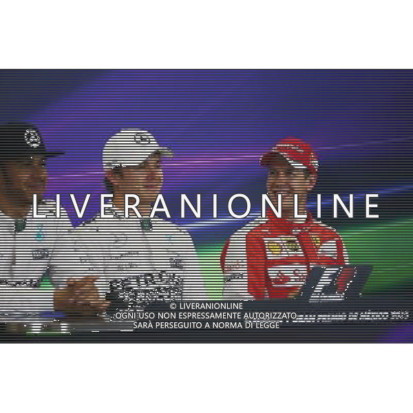 The post qualifying FIA Press Conference (L to R): Lewis Hamilton (GBR) Mercedes AMG F1, second; Nico Rosberg (GER) Mercedes AMG F1, pole position; Sebastian Vettel (GER) Ferrari, third. 31.10.2015. Formula 1 World Championship, Rd 17, Mexican Grand Prix, Mexixo City, Mexico, Qualifying Day. /AGENZIA ALDO LIVERANI SAS - EDITORIAL USE ONLY