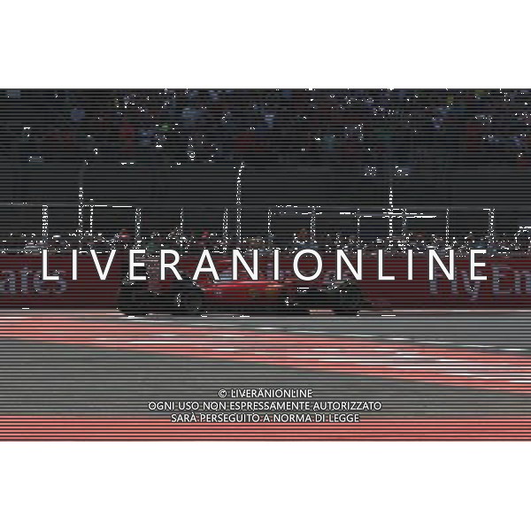 Sebastian Vettel (GER) Ferrari SF15-T with a puncture on the opening lap of the race. 01.11.2015. Formula 1 World Championship, Rd 17, Mexican Grand Prix, Mexixo City, Mexico, Race Day. AG ALDO LIVERANI SAS ONLY ITALY