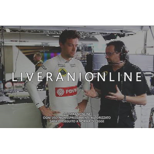 (L to R): Jolyon Palmer (GBR) Lotus F1 Team Test and Reserve Driver with Julien Simon-Chautemps (FRA) Lotus F1 Team Race Engineer. 13.11.2015. Formula 1 World Championship, Rd 18, Brazilian Grand Prix, Sao Paulo, Brazil, Practice Day. AG ALDO LIVERANI SAS ONLY ITALY