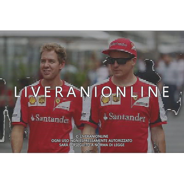 (L to R): Sebastian Vettel (GER) Ferrari with team mate Kimi Raikkonen (FIN) Ferrari. 13.11.2015. Formula 1 World Championship, Rd 18, Brazilian Grand Prix, Sao Paulo, Brazil, Practice Day. /AGENZIA ALDO LIVERANI SAS - ITALY ONLY - EDITORIAL USE ONLY - Gran Premio del Brasile F1 Prove Libere