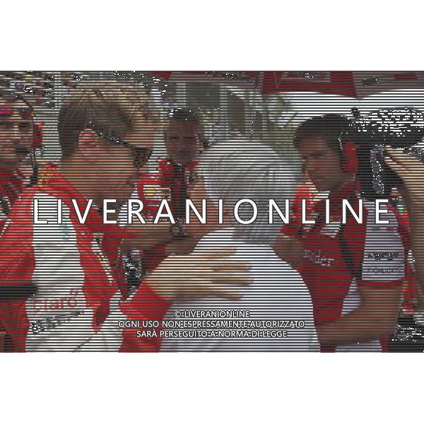 (L to R): Sebastian Vettel (GER) Ferrari with Bernie Ecclestone (GBR) on the grid. 15.11.2015. Formula 1 World Championship, Rd 18, Brazilian Grand Prix, Sao Paulo, Brazil, Race Day. AG ALDO LIVERANI SAS ONLY ITALY