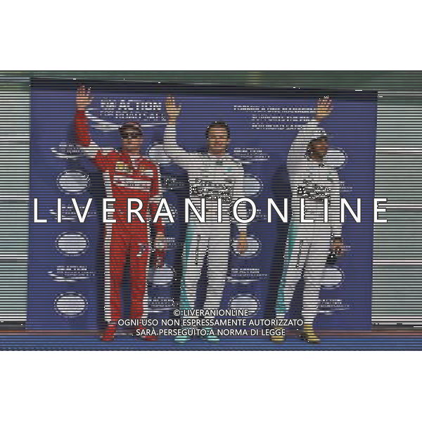 Qualifying top three in parc ferme (L to R): Kimi Raikkonen (FIN) Ferrari, third; Nico Rosberg (GER) Mercedes AMG F1, pole position; Lewis Hamilton (GBR) Mercedes AMG F1, second. 28.11.2015. Formula 1 World Championship, Rd 19, Abu Dhabi Grand Prix, Yas Marina Circuit, Abu Dhabi, Qualifying Day. AG ALDO LIVERANI SAS ONLY ITALY