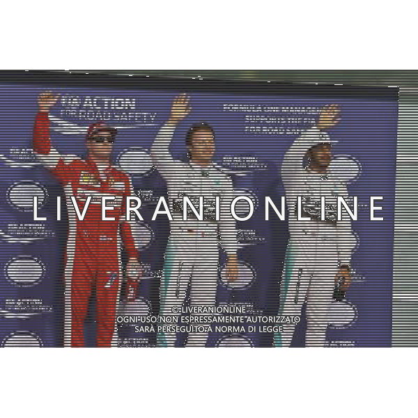 Qualifying top three in parc ferme (L to R): Kimi Raikkonen (FIN) Ferrari, third; Nico Rosberg (GER) Mercedes AMG F1, pole position; Lewis Hamilton (GBR) Mercedes AMG F1, second. 28.11.2015. Formula 1 World Championship, Rd 19, Abu Dhabi Grand Prix, Yas Marina Circuit, Abu Dhabi, Qualifying Day. AG ALDO LIVERANI SAS ONLY ITALY