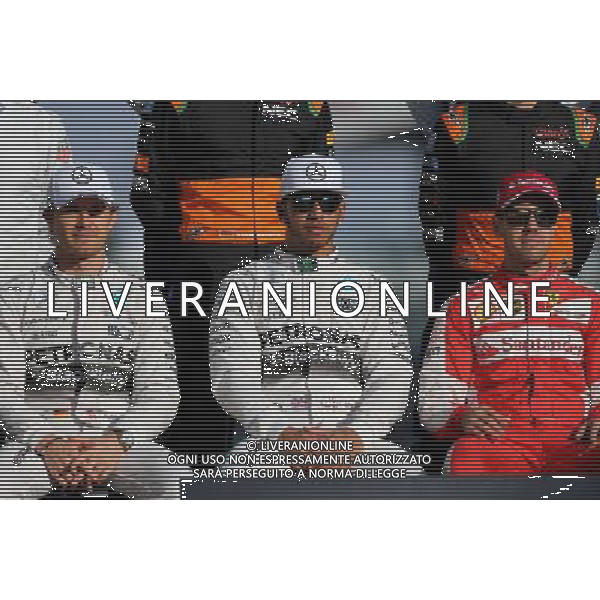 Nico Rosberg (GER), Mercedes AMG F1 Team, Lewis Hamilton (GBR), Mercedes AMG F1 Team and Sebastian Vettel (GER), Scuderia Ferrari 29.11.2015. Formula 1 World Championship, Rd 19, Abu Dhabi Grand Prix, Yas Marina Circuit, Abu Dhabi, Race Day. AG ALDO LIVERANI SAS ONLY ITALY
