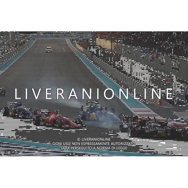 Pastor Maldonado (VEN) Lotus F1 E23 and Fernando Alonso (ESP) McLaren MP4-30 make contact at the start of the race. 29.11.2015. Formula 1 World Championship, Rd 19, Abu Dhabi Grand Prix, Yas Marina Circuit, Abu Dhabi, Race Day. AG ALDO LIVERANI SAS ONLY ITALY