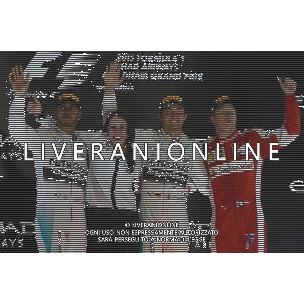 1st place Nico Rosberg (GER) Mercedes AMG F1 W06, with 2nd place Lewis Hamilton (GBR) Mercedes AMG F1 W06 and 3rd place Kimi Raikkonen (FIN) Ferrari SF15-T. 29.11.2015. Formula 1 World Championship, Rd 19, Abu Dhabi Grand Prix, Yas Marina Circuit, Abu Dhabi, Race Day. AG ALDO LIVERANI SAS ONLY ITALY