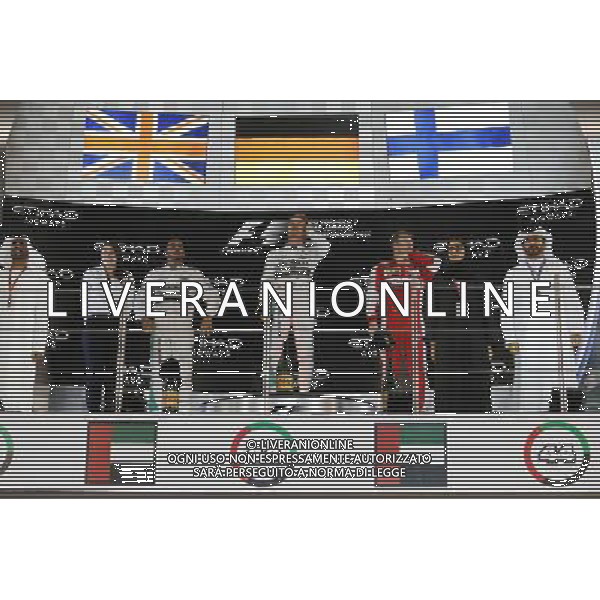 The podium (L to R): Lewis Hamilton (GBR) Mercedes AMG F1, second; Nico Rosberg (GER) Mercedes AMG F1, race winner; Kimi Raikkonen (FIN) Ferrari, third. 29.11.2015. Formula 1 World Championship, Rd 19, Abu Dhabi Grand Prix, Yas Marina Circuit, Abu Dhabi, Race Day. AG ALDO LIVERANI SAS ONLY ITALY
