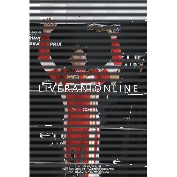 Kimi Raikkonen (FIN) Ferrari celebrates his third position on the podium. 29.11.2015. Formula 1 World Championship, Rd 19, Abu Dhabi Grand Prix, Yas Marina Circuit, Abu Dhabi, Race Day. AG ALDO LIVERANI SAS ONLY ITALY