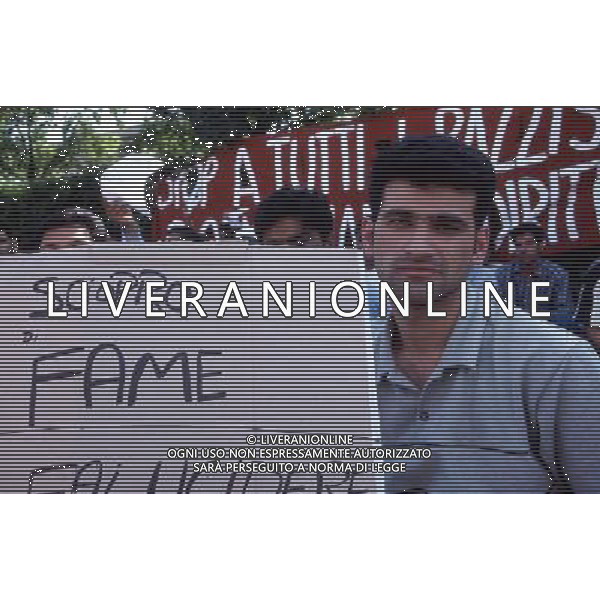 brescia emmigrati mentre manifestano foto filippo venezia-Ag aldo liverani