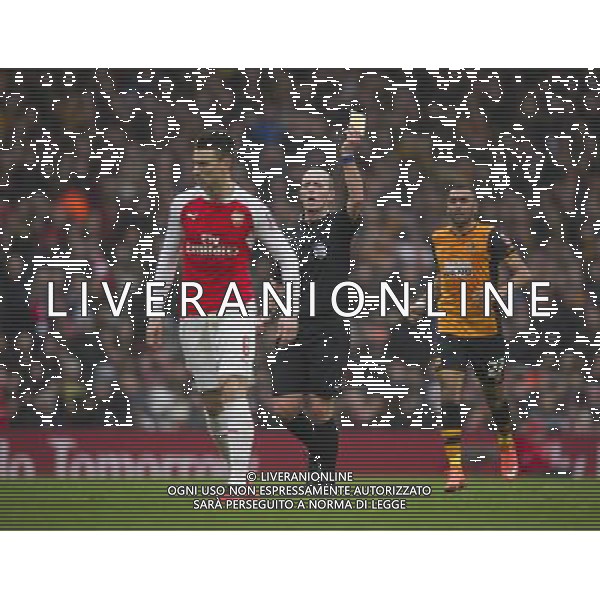 Arsenal\'s Laurent Koscielny is shown a yellow card by Referee Mike Dean Photographer Ashley Western/CameraSport Football - The FA Cup Fifth Round - Arsenal v Hull City - Saturday 20th February 2016 - Emirates Stadium - London © CameraSport - 43 Linden Ave. Countesthorpe. Leicester. England. LE8 5PG - Tel: +44 (0) 116 277 4147 - admin@camerasport.com - www.camerasport.com / AGENZIA ALDO LIVERANI SAS - EDITORIAL USE ONLY 