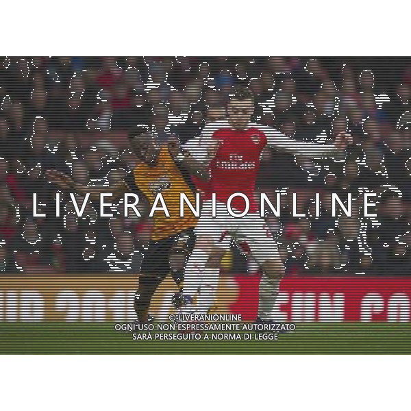 Arsenal\'s Calum Chambers battles for possession with Hull City\'s Moses Odubajo Photographer Ashley Western/CameraSport Football - The FA Cup Fifth Round - Arsenal v Hull City - Saturday 20th February 2016 - Emirates Stadium - London © CameraSport - 43 Linden Ave. Countesthorpe. Leicester. England. LE8 5PG - Tel: +44 (0) 116 277 4147 - admin@camerasport.com - www.camerasport.com / AGENZIA ALDO LIVERANI SAS - EDITORIAL USE ONLY 