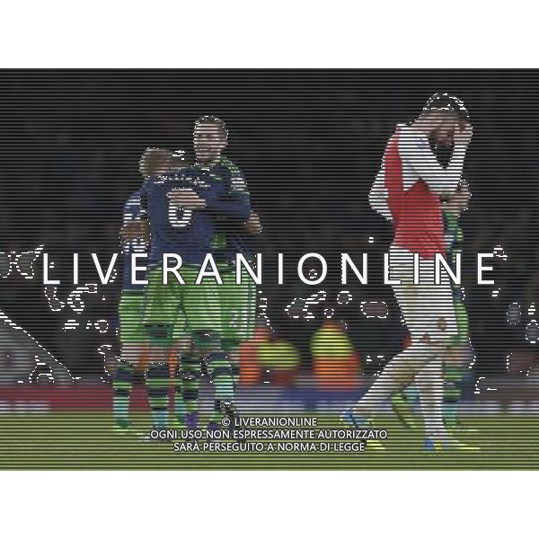 Swansea City\'s Gylfi Sigurdsson (right) and Ashley Williams celebrate their side\'s 1-2 victory at full time Photographer Craig Mercer/CameraSport Football - Barclays Premiership - Arsenal v Swansea City - Wednesday 2nd March 2016 - Emirates Stadium - London © CameraSport - 43 Linden Ave. Countesthorpe. Leicester. England. LE8 5PG - Tel: +44 (0) 116 277 4147 - admin@camerasport.com - www.camerasport.com AG ALDO LIVERANI SAS ONLY ITALY