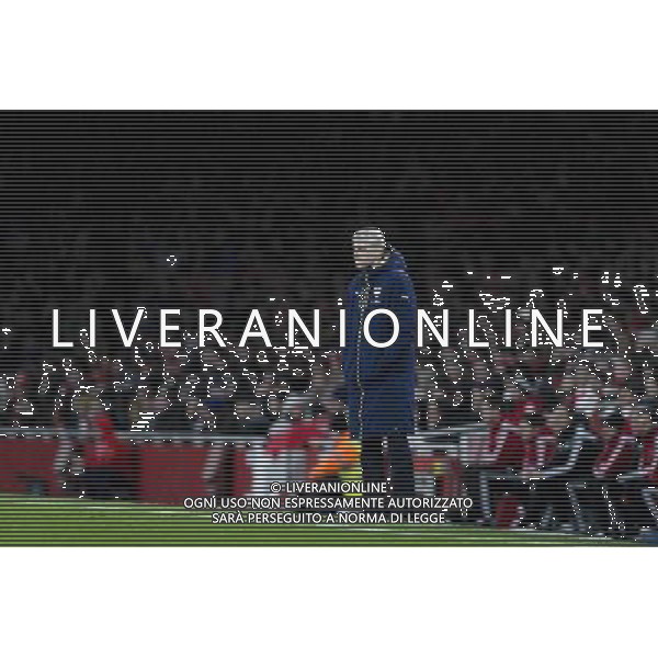 Arsenal manager Arsene Wenger looks an isolated figure in the rain at the Emirates Stadium Photographer Craig Mercer/CameraSport Football - Barclays Premiership - Arsenal v Swansea City - Wednesday 2nd March 2016 - Emirates Stadium - London © CameraSport - 43 Linden Ave. Countesthorpe. Leicester. England. LE8 5PG - Tel: +44 (0) 116 277 4147 - admin@camerasport.com - www.camerasport.com AG ALDO LIVERANI SAS ONLY ITALY