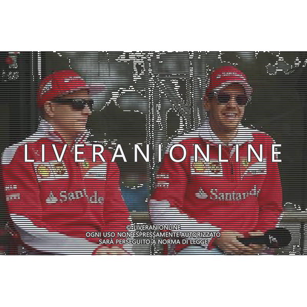 (L to R): Kimi Raikkonen (FIN) Ferrari with team mate Sebastian Vettel (GER) Ferrari. 19.03.2016. Formula 1 World Championship, Rd 1, Australian Grand Prix, Albert Park, Melbourne, Australia, Qualifying Day. - www.xpbimages.com, EMail: requests@xpbimages.com - copy of publication required for printed pictures. Every used picture is fee-liable. © Copyright: Batchelor / XPB Images /Agenzia Aldo Liverani s.a.s./ONLY ITALY-EDITORIAL USE ONLY