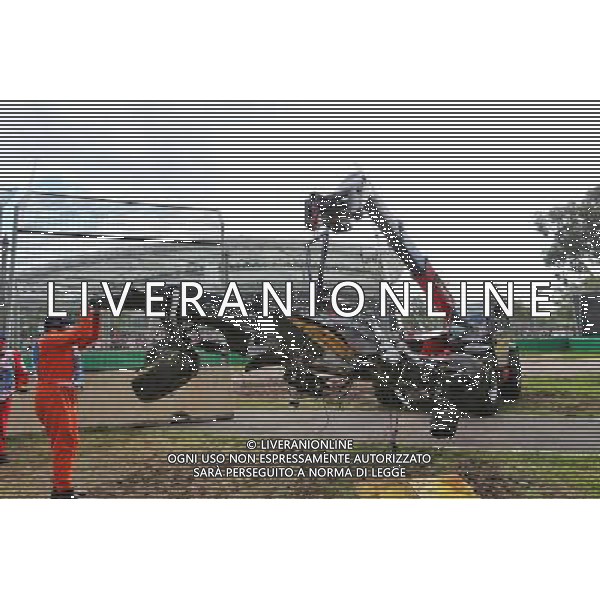 The McLaren MP4-31 of Fernando Alonso (ESP) McLaren is removed from the gravel trap after his race stopping crash. 20.03.2016. Formula 1 World Championship, Rd 1, Australian Grand Prix, Albert Park, Melbourne, Australia, Race Day. - www.xpbimages.com, EMail: requests@xpbimages.com - copy of publication required for printed pictures. Every used picture is fee-liable. Â© Copyright: Charniaux / XPB Images/Agenzia Aldo Liverani s.a.s./ONLY ITALY/EDITORIAL USE ONLY