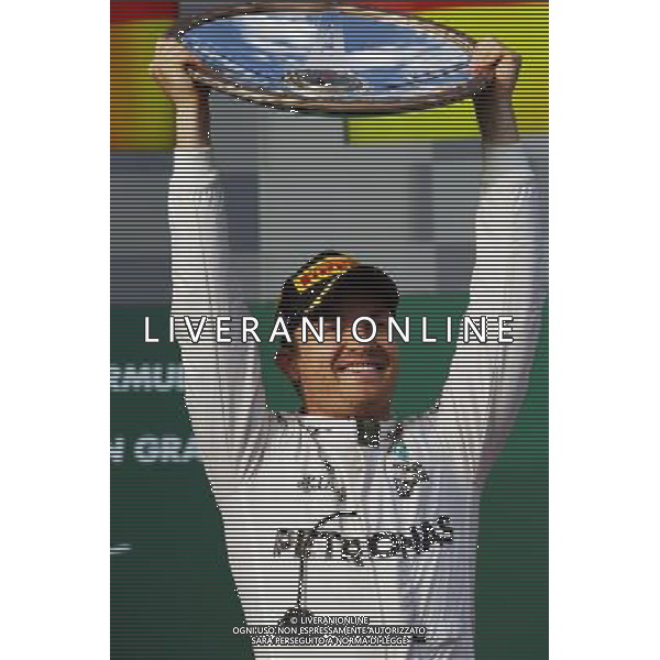 Race winner Nico Rosberg (GER) Mercedes AMG F1 celebrates on the podium. 20.03.2016. Formula 1 World Championship, Rd 1, Australian Grand Prix, Albert Park, Melbourne, Australia, Race Day. - www.xpbimages.com, EMail: requests@xpbimages.com - copy of publication required for printed pictures. Every used picture is fee-liable. Â© Copyright: Moy / XPB Images/Agenzia Aldo Liverani s.a.s./ONLY ITALY/EDITORIAL USE ONLY