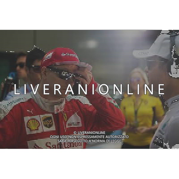 Kimi Raikkonen (FIN) Ferrari with Nico Rosberg (GER) Mercedes AMG F1 on the drivers parade. 20.03.2016. Formula 1 World Championship, Rd 1, Australian Grand Prix, Albert Park, Melbourne, Australia, Race Day. / AGENZIA ALDO LIVERANI SAS - ITALY ONLY EDITORIAL USE ONLY