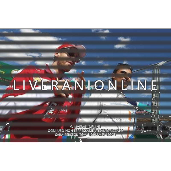 (L to R): Sebastian Vettel (GER) Ferrari with Rio Haryanto (IDN) Manor Racing. 20.03.2016. Formula 1 World Championship, Rd 1, Australian Grand Prix, Albert Park, Melbourne, Australia, Race Day. / AGENZIA ALDO LIVERANI SAS - ITALY ONLY EDITORIAL USE ONLY