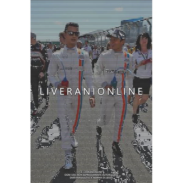 (L to R): Pascal Wehrlein (GER) Manor Racing with team mate Rio Haryanto (IDN) Manor Racing. 20.03.2016. Formula 1 World Championship, Rd 1, Australian Grand Prix, Albert Park, Melbourne, Australia, Race Day. / AGENZIA ALDO LIVERANI SAS - ITALY ONLY EDITORIAL USE ONLY