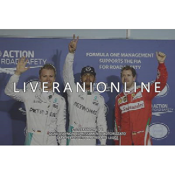 Pole for Lewis Hamilton (GBR) Mercedes AMG F1 W07 , 2nd for Nico Rosberg (GER) Mercedes AMG Petronas F1 W07, and 3rd for Sebastian Vettel (GER) Scuderia Ferrari SF16-H. 02.04.2016. Formula 1 World Championship, Rd 2, Bahrain Grand Prix, Sakhir, Bahrain, Qualifying Day. AG ALDO LIVERANI SAS ONLY ITALY