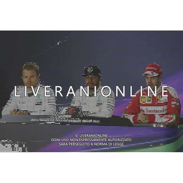 The post qualifying FIA Press Conference (L to R): Nico Rosberg (GER) Mercedes AMG F1; Lewis Hamilton (GBR) Mercedes AMG F1; Sebastian Vettel (GER) Ferrari. 02.04.2016. Formula 1 World Championship, Rd 2, Bahrain Grand Prix, Sakhir, Bahrain, Qualifying Day. AG ALDO LIVERANI SAS ONLY ITALY