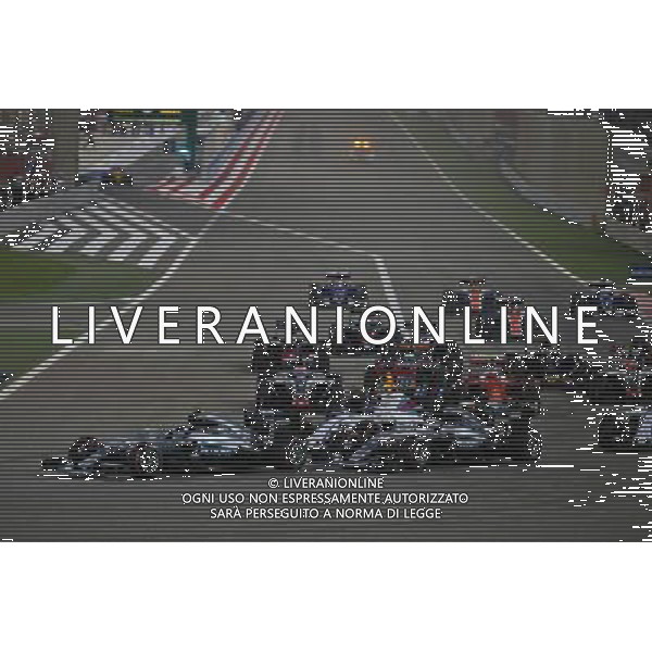 Nico Rosberg (GER) Mercedes AMG F1 W07 Hybrid leads at the start of the race as Lewis Hamilton (GBR) Mercedes AMG F1 W07 Hybrid and Valtteri Bottas (FIN) Williams FW38 make contact. 03.04.2016. Formula 1 World Championship, Rd 2, Bahrain Grand Prix, Sakhir, Bahrain, Race Day. AG ALDO LIVERANI SAS ONLY ITALY