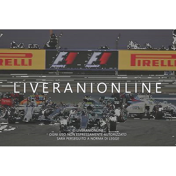 Nico Rosberg (GER) Mercedes AMG F1 W07 Hybrid leads at the start of the race as Lewis Hamilton (GBR) Mercedes AMG F1 W07 Hybrid and Valtteri Bottas (FIN) Williams FW38 make contact. 03.04.2016. Formula 1 World Championship, Rd 2, Bahrain Grand Prix, Sakhir, Bahrain, Race Day. AG ALDO LIVERANI SAS ONLY ITALY