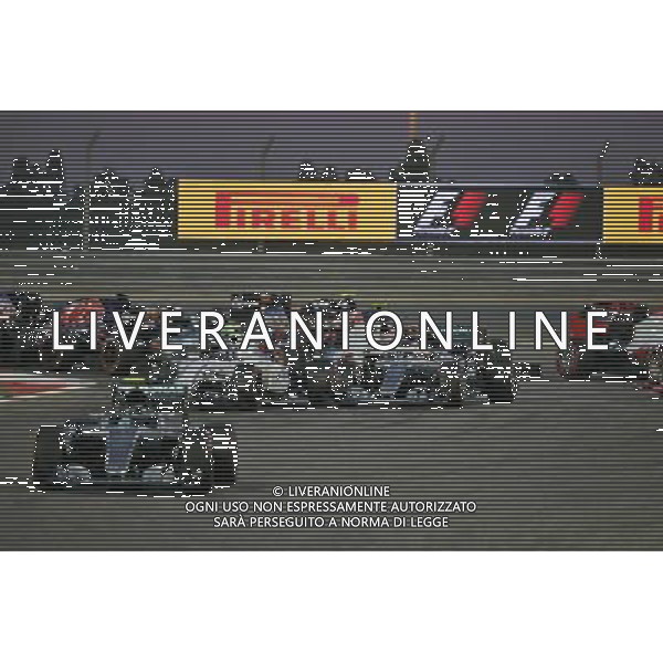 Nico Rosberg (GER) Mercedes AMG F1 W07 Hybrid leads at the start of the race as Lewis Hamilton (GBR) Mercedes AMG F1 W07 Hybrid and Valtteri Bottas (FIN) Williams FW38 make contact. 03.04.2016. Formula 1 World Championship, Rd 2, Bahrain Grand Prix, Sakhir, Bahrain, Race Day. AG ALDO LIVERANI SAS ONLY ITALY