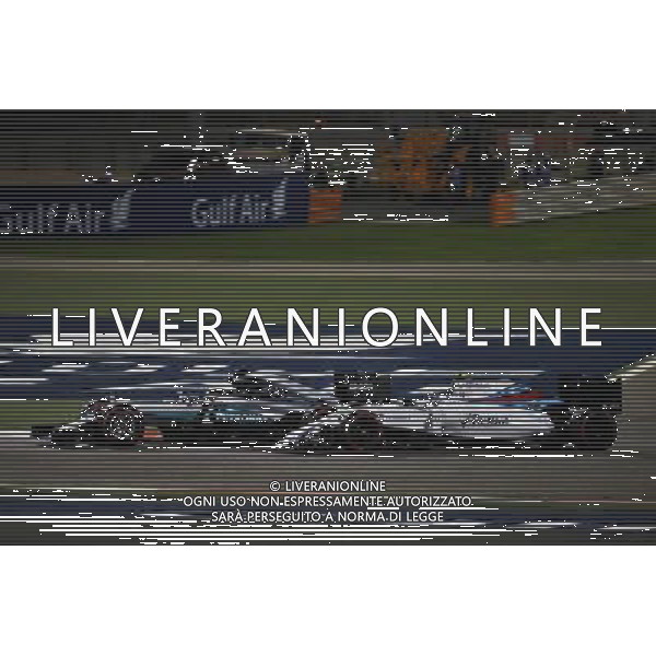 Lewis Hamilton (GBR) Mercedes AMG F1 W07 Hybrid and Valtteri Bottas (FIN) Williams FW38 battle for position. 03.04.2016. Formula 1 World Championship, Rd 2, Bahrain Grand Prix, Sakhir, Bahrain, Race Day. AG ALDO LIVERANI SAS ONLY ITALY