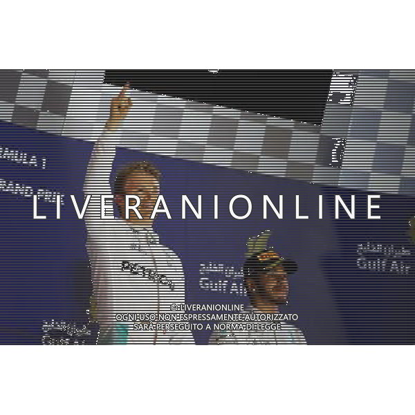 (L to R): Race winner Nico Rosberg (GER) Mercedes AMG F1 celebrates on the podium alongside third placed team mate Lewis Hamilton (GBR) Mercedes AMG F1. 03.04.2016. Formula 1 World Championship, Rd 2, Bahrain Grand Prix, Sakhir, Bahrain, Race Day. AG ALDO LIVERANI SAS ONLY ITALY