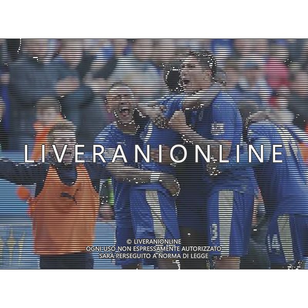 Leicester City\'s Leonardo Ulloa is swamped by team-mates as he celebrates scoring his sides second and equalising goal in time added on to secure a point in a 2-2 draw Photographer Stephen White/CameraSport Football - Barclays Premiership - Leicester City v West Ham United - Sunday 17th April 2016 - King Power Stadium - Leicester © CameraSport - 43 Linden Ave. Countesthorpe. Leicester. England. LE8 5PG - Tel: +44 (0) 116 277 4147 - admin@camerasport.com - www.camerasport.com AG ALDO LIVERANI SAS ONLY ITALY