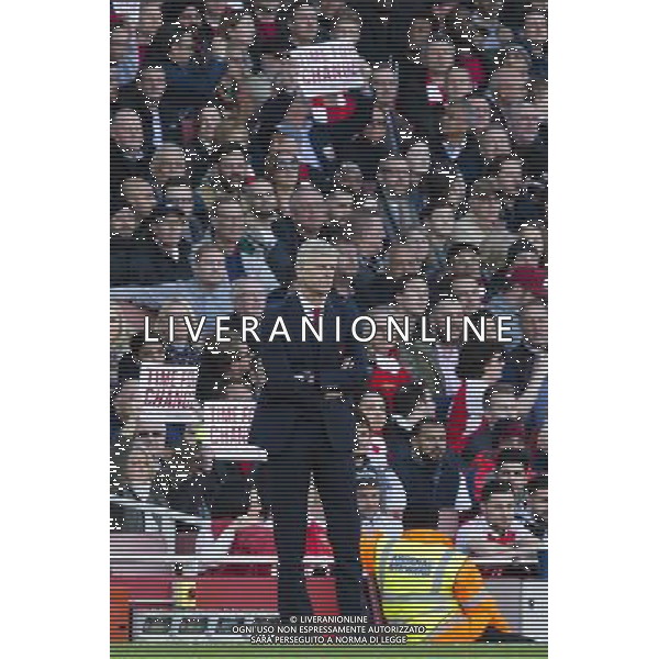 Arsenal fans hold up banners saying \'Time for Change\' behind Arsenal manager Arsne Wenger in protest against the current management and board at the club Photographer Craig Mercer/CameraSport Football - Barclays Premiership - Arsenal v Norwich City - Saturday 30th April 2016 - Emirates stadium - London © CameraSport - 43 Linden Ave. Countesthorpe. Leicester. England. LE8 5PG - Tel: +44 (0) 116 277 4147 - admin@camerasport.com - www.camerasport.com AG ALDO LIVERANI SAS ONLY ITALY