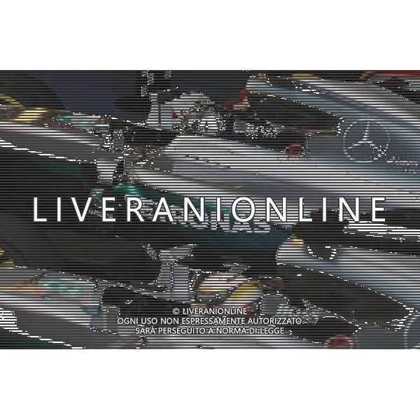 Race winner Nico Rosberg (GER) Mercedes AMG F1 W07 Hybrid and second placed team mate Lewis Hamilton (GBR) Mercedes AMG F1 W07 Hybrid in parc ferme. 01.05.2016. Formula 1 World Championship, Rd 4, Russian Grand Prix, Sochi Autodrom, Sochi, Russia, Race Day. AG ALDO LIVERANI SAS ONLY ITALY