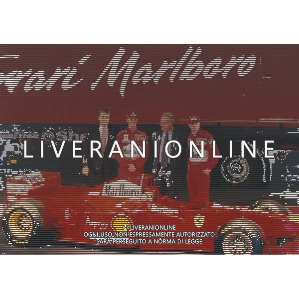 07-01-1997 PRESENTAZIONE FERRARI RETROSPETTIVA MICHAEL SCHUMACHER PILOTA NELLA FOTO MICHAEL SCHUMACHER CON LUCA CORDERO DI MONTEZEMOLO CESARE ROMITI ED EDDIE IRVINE AG ALDO LIVERANI SAS
