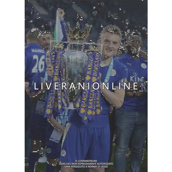 Leicester City\'s Jamie Vardy celebrating with the Barclays premiership Trophy at the end of todays match Photographer Rachel Holborn/CameraSport Football - Barclays Premiership - Leicester City v Everton - Saturday 7th May 2016 - King Power Stadium - Leicester Â© CameraSport - 43 Linden Ave. Countesthorpe. Leicester. England. LE8 5PG - Tel: +44 (0) 116 277 4147 - admin@camerasport.com - www.camerasport.com / AGENZIA ALDO LIVERANI SAS - ITALY ONLY EDITORIAL USE ONLY
