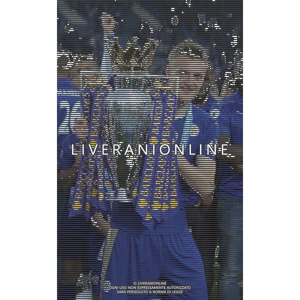 Leicester City\'s Jamie Vardy celebrating with the Barclays premiership Trophy at the end of todays match Photographer Rachel Holborn/CameraSport Football - Barclays Premiership - Leicester City v Everton - Saturday 7th May 2016 - King Power Stadium - Leicester Â© CameraSport - 43 Linden Ave. Countesthorpe. Leicester. England. LE8 5PG - Tel: +44 (0) 116 277 4147 - admin@camerasport.com - www.camerasport.com / AGENZIA ALDO LIVERANI SAS - ITALY ONLY EDITORIAL USE ONLY