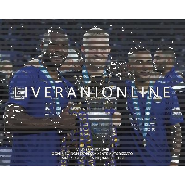 Leicester City\'s Wes Morgan Leicester City\'s Kasper Schmeichel and Leicester City\'s Danny Simpson celebrate at the end of todays match Photographer Rachel Holborn/CameraSport Football - Barclays Premiership - Leicester City v Everton - Saturday 7th May 2016 - King Power Stadium - Leicester Â© CameraSport - 43 Linden Ave. Countesthorpe. Leicester. England. LE8 5PG - Tel: +44 (0) 116 277 4147 - admin@camerasport.com - www.camerasport.com / AGENZIA ALDO LIVERANI SAS - ITALY ONLY EDITORIAL USE ONLY