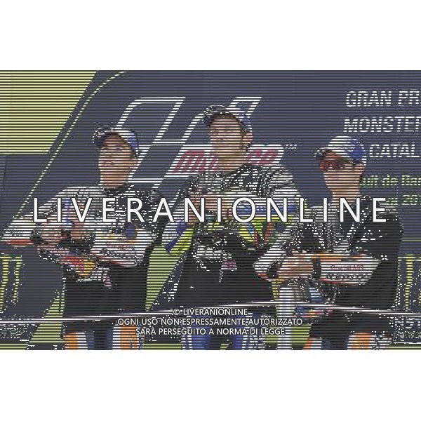 05.06.2016. MontmelÃ², Spagna. Marc Marquez, Valentino Rossi, Dani Pedrosa con le magliette commemorative per la morte di Luis Salom pilota spagnolo di moto2. Â©PIAZZOLLA AGENZIA ALDO LIVERANI SAS Montmelo\' Gp Spagna - motomondiale Gran Premio di Catalunya Gara e Podio 05.06.2016