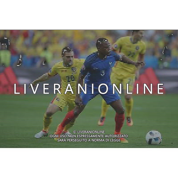 SAINT-DENIS 10.06.2016 MECZ I RUNDA GRUPA A MISTRZOSTW EUROPY 2016: FRANCJA - RUMUNIA --- FIRST ROUND GROUP A UEFA EURO 2016 MATCH: FRANCE - ROMANIA ADRIAN POPA PATRICE EVRA FOT. PIOTR KUCZA/NEWSPIX.PL / AGENZIA ALDO LIVERANI SAS - ITALY ONLY EDITORIAL USE ONLY - Francia - Romania UEFA Francia EURO 2016 Final Tournament Group Stage A Parigi - 10.06.2016