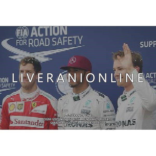 Qualifying top three in parc ferme (L to R): Sebastian Vettel (GER) Ferrari, third; Lewis Hamilton (GBR) Mercedes AMG F1, pole position; Nico Rosberg (GER) Mercedes AMG F1, second. 11.06.2016. Formula 1 World Championship, Rd 7, Canadian Grand Prix, Montreal, Canada, Qualifying Day. AG ALDO LIVERANI SAS ONLY ITALY