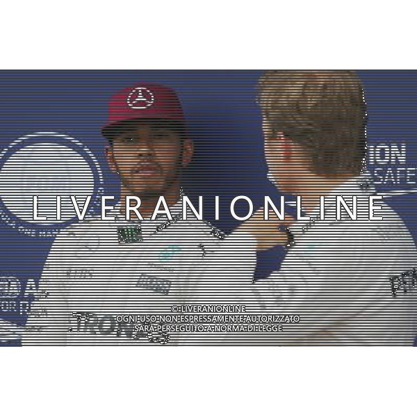 (L to R): Pole sitter Lewis Hamilton (GBR) Mercedes AMG F1 with second placed team mate Nico Rosberg (GER) Mercedes AMG F1 in qualifying parc ferme. 11.06.2016. Formula 1 World Championship, Rd 7, Canadian Grand Prix, Montreal, Canada, Qualifying Day. AG ALDO LIVERANI SAS ONLY ITALY