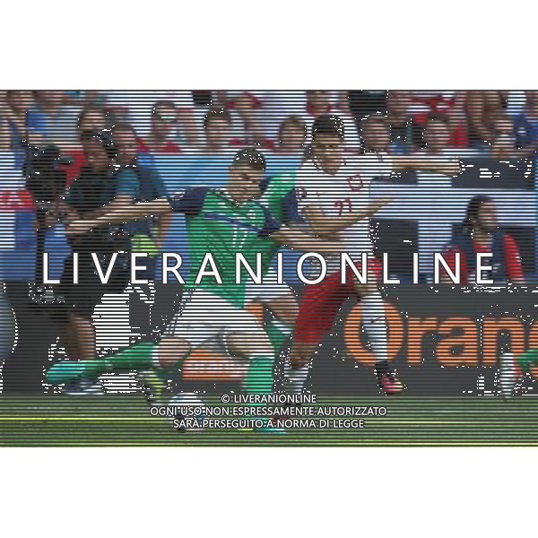 NICEA 12.06.2016 MECZ I RUNDA GRUPA C MISTRZOSTW EUROPY 2016: POLSKA - IRLANDIA POLNOCNA --- FIRST ROUND GROUP C UEFA EURO 2016 MATCH IN NICE: POLAND - NORTHERN IRELAND PADDY MCNAIR BARTOSZ KAPUSTKA FOT. PIOTR KUCZA/NEWSPIX.PL --- Newspix.pl / AGENZIA ALDO LIVERANI SAS - ITALY ONLY EDITORIAL USE ONLY / AGENZIA ALDO LIVERANI SAS - ITALY ONLY EDITORIAL USE ONLY - Polonia - Irlanda del Nord UEFA Francia EURO 2016 Final Tournament Group Stage C Nizza - 12.06.2016