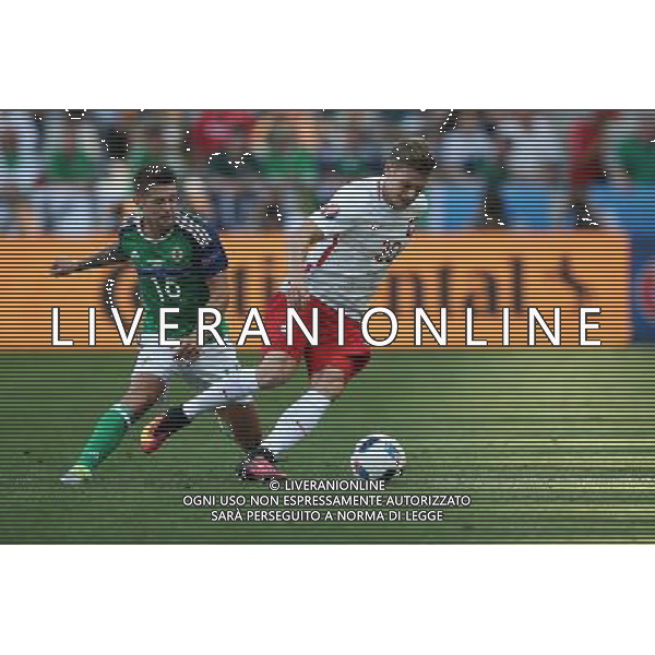 12.06.2016 NICEA, FRANCJA (NICE, FRANCE) PILKA NOZNA (FOOTBALL) UEFA EURO 2016 MISTRZOSTWA EUROPY W PILCE NOZNEJ (UEFA EURO 2016) GRUPA C (GROUP C) MECZ POLSKA - IRLANDIA POLNOCNA (GAME POLAND - NORTHERN IRELAND) NZ OLIVER NORWOOD, LUKASZ PISZCZEK FOTO LUKASZ GROCHALA/CYFRASPORT / NEWSPIX.PL --- Newspix.pl / AGENZIA ALDO LIVERANI SAS - ITALY ONLY EDITORIAL USE ONLY / AGENZIA ALDO LIVERANI SAS - ITALY ONLY EDITORIAL USE ONLY - Polonia - Irlanda del Nord UEFA Francia EURO 2016 Final Tournament Group Stage C Nizza - 12.06.2016