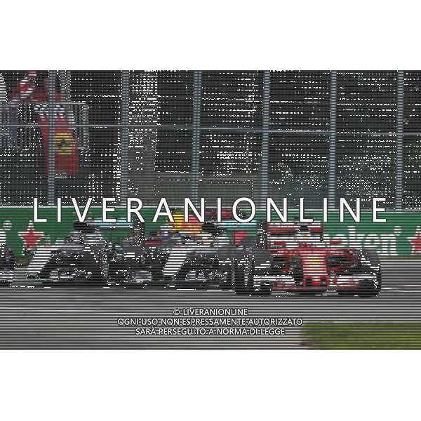 Sebastian Vettel (GER) Ferrari SF16-H leads Lewis Hamilton (GBR) Mercedes AMG F1 W07 Hybrid and Nico Rosberg (GER) Mercedes AMG F1 W07 Hybrid at the start of the race. 12.06.2016. Formula 1 World Championship, Rd 7, Canadian Grand Prix, Montreal, Canada, Race Day. AG ALDO LIVERANI SAS ONLY ITALY