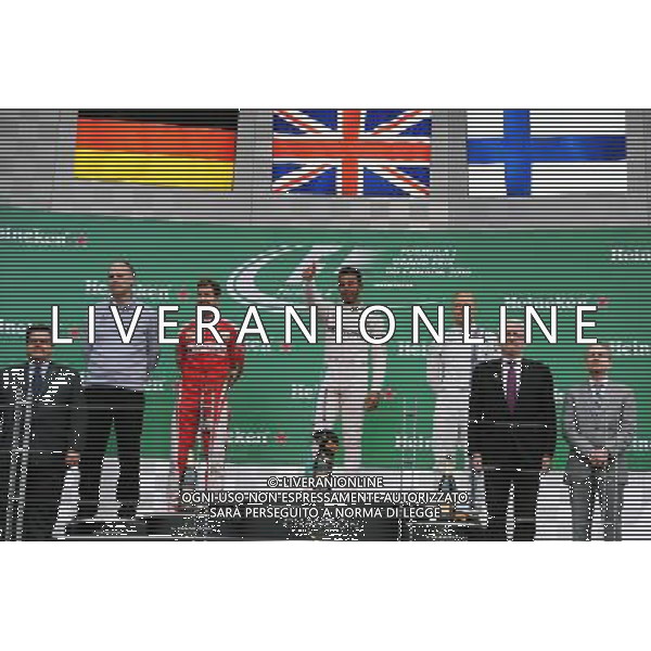 The podium (L to R): Sebastian Vettel (GER) Ferrari, second; Lewis Hamilton (GBR) Mercedes AMG F1, race winner; Valtteri Bottas (FIN) Williams, third. 12.06.2016. Formula 1 World Championship, Rd 7, Canadian Grand Prix, Montreal, Canada, Race Day. AG ALDO LIVERANI SAS ONLY ITALY